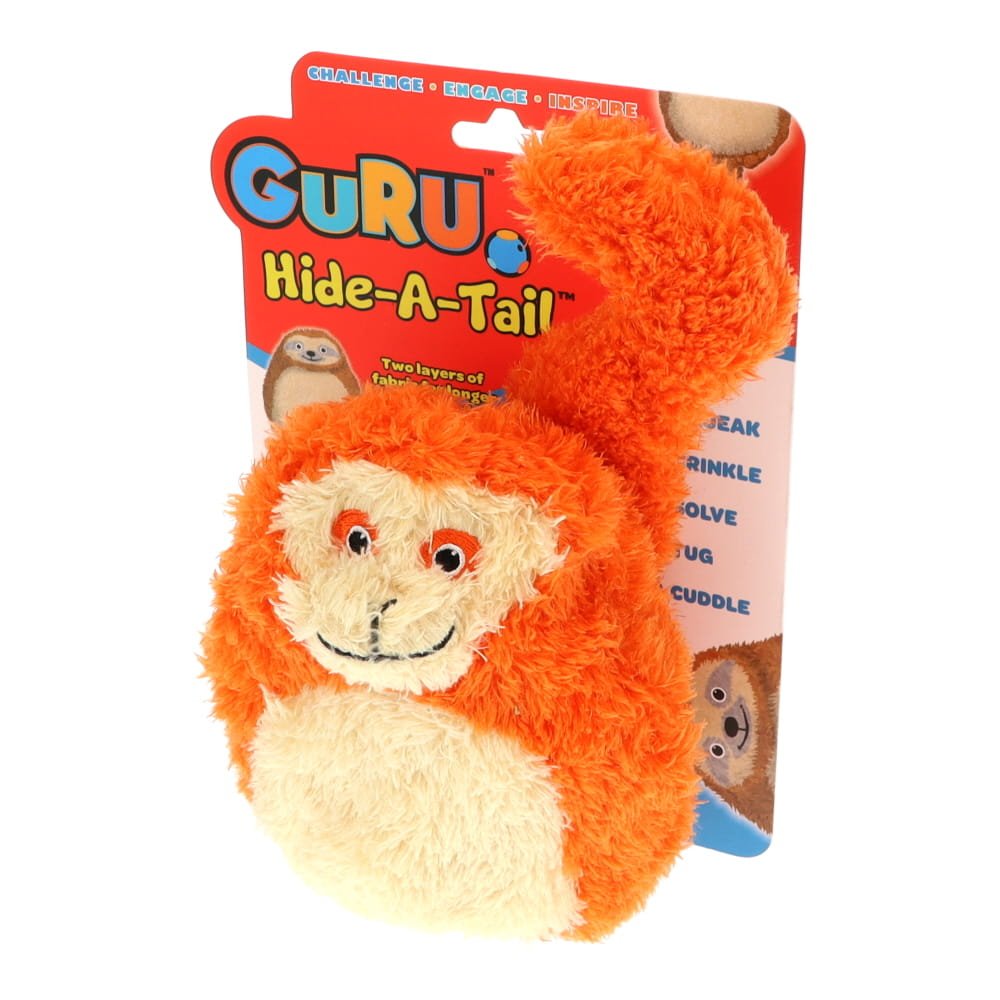 Orange monkey-shaped toy with 'Guru Hide-A-Tail' packaging on a white background